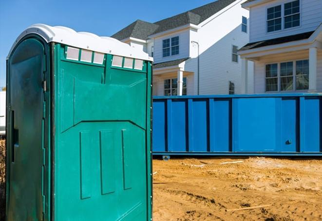 a portable toilet lineup at an active work site